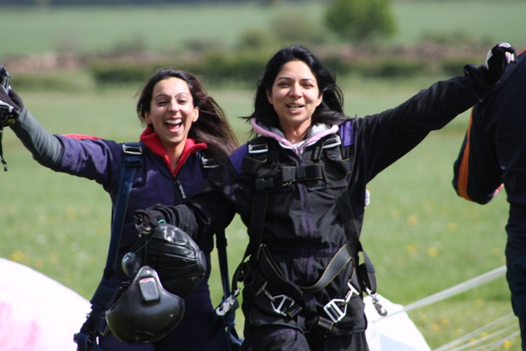 Happy Skydiving couple just after landing